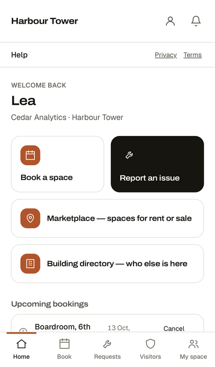 The tenant's home screen in the Premise app: book a space, report an issue, building directory